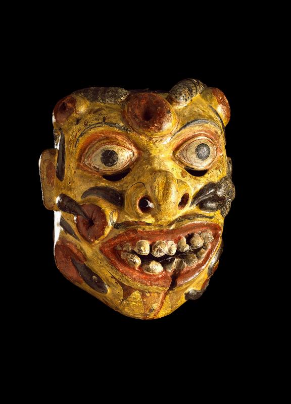 Carved and polychrome painted wooden face mask representing