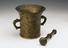 Large light-coloured bronze mortar and pestle