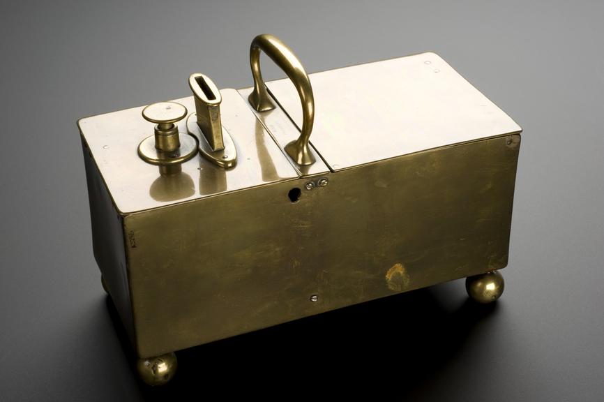 Penny-slot mechanical tobacco box, all brass with key