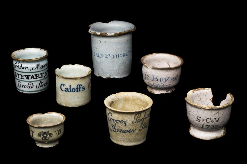 From left to right: Earthenware dispensing pot, tin glazed