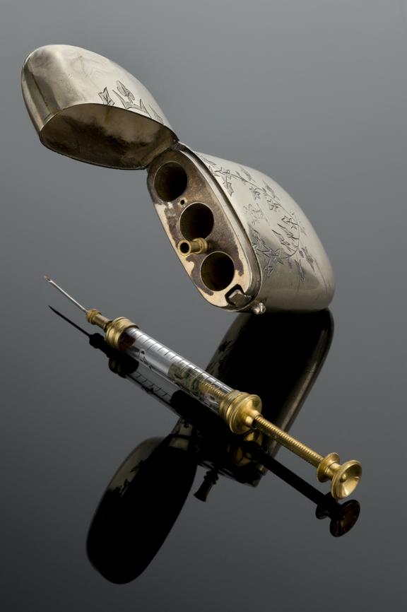 Hypodermic syringe, with spare needle, in case