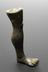 Votive leg, bronze,Roman(?) Graduated grey background.