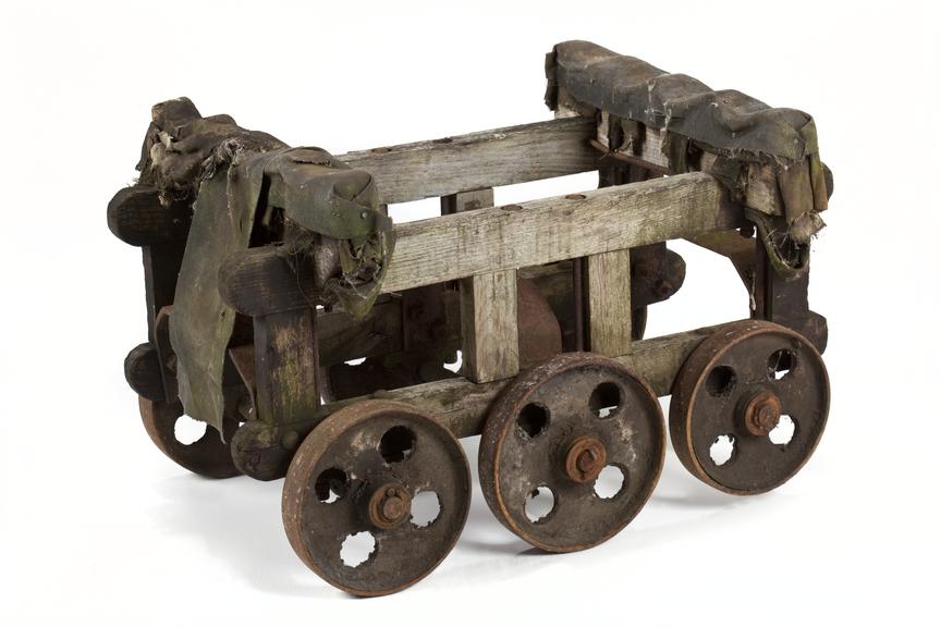 Wooden trolley for moving rollers within the factory