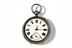 Pocket watch, photographed from above on a white background.