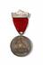 Medal with ribbon and brooch