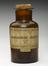 500g glass jar containing manganese dioxide black, 1909-1950