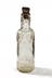 Tizer bottle photographed staight on on a white background