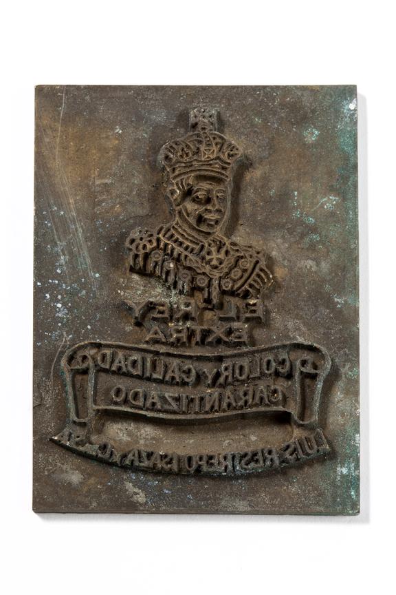 Rectangular printing plate with an image of a king and has 'EL