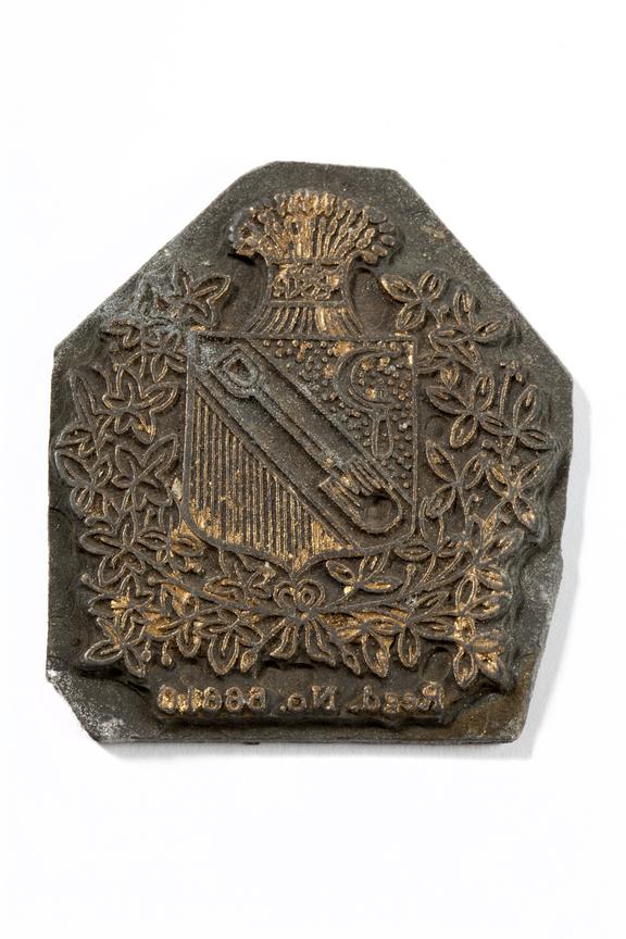 Textile printing plate with lauretted crest on it