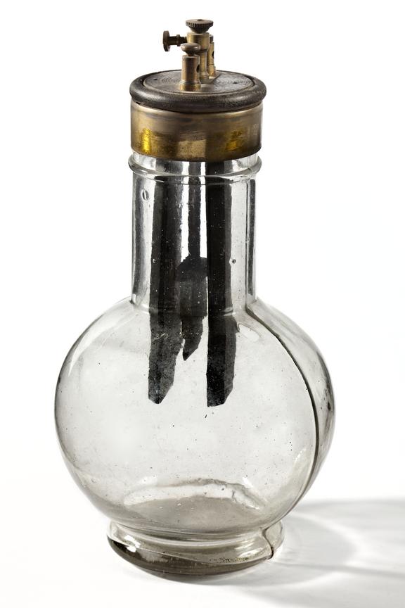 Electric wet cell (wet bulb battery) Photographed on a white