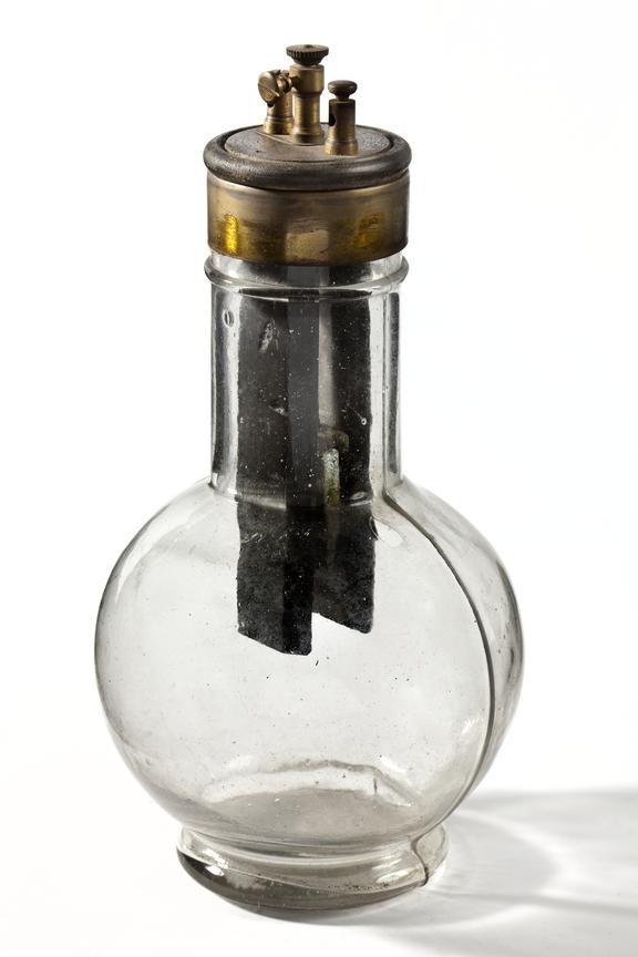 Electric wet cell (wet bulb battery) Photographed on a white
