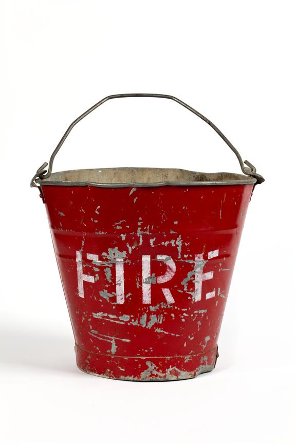 Fire bucket photographed straight on view on a white background.