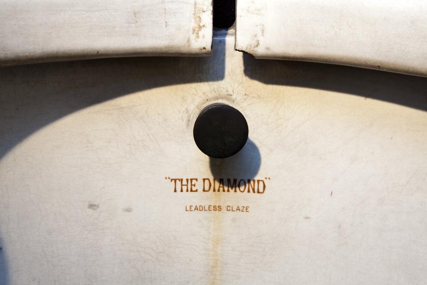 Central section of urinal; bears the inscription 'The Diamond