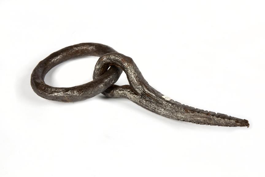 Wrought iron ring and hook used in underground canals. c