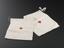 2 small white cloth bags