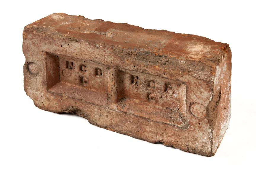 Brick engraved 'NCB' twice