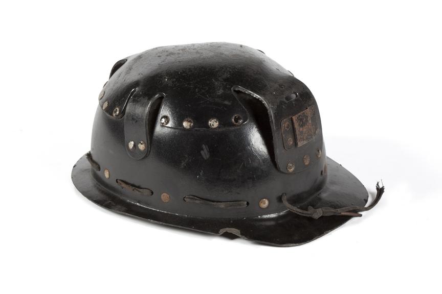 Fibrous miner's hard hat.