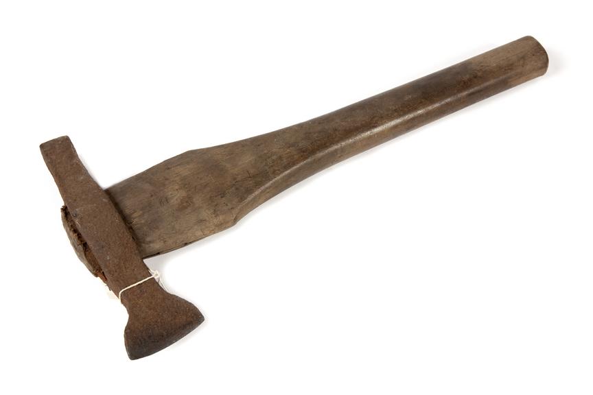 Pit brow woman hammer photographed 3/4 view on a white