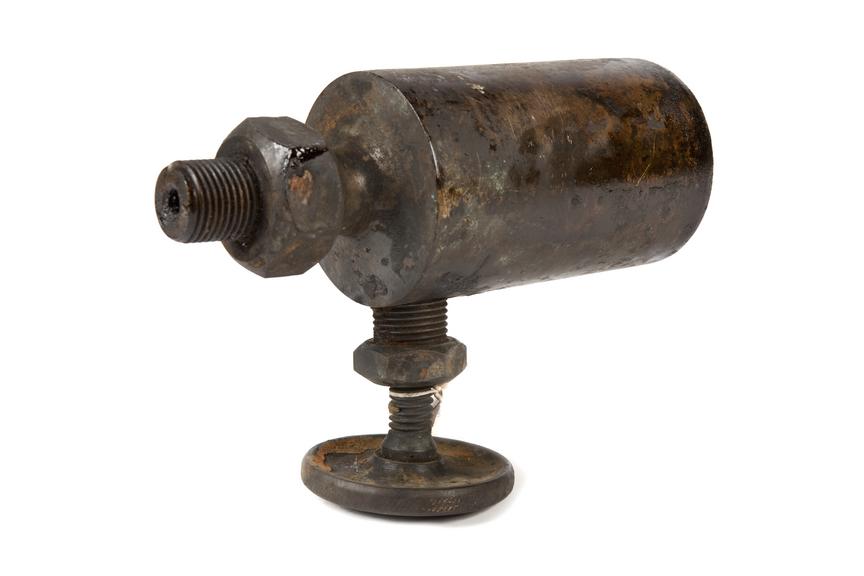 Steam lubricator photographed on a white background.