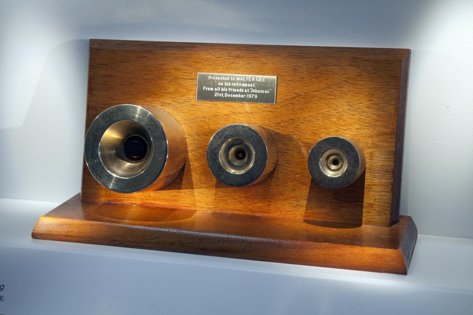 Three gold-plated cable dies