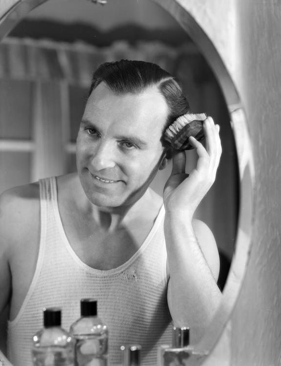 Man brushing his hair