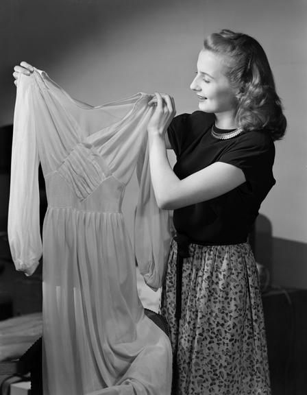 Woman admiring an evening dress