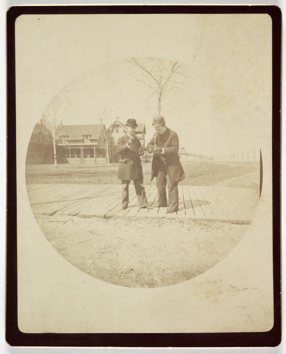 Two men on a boardwalk