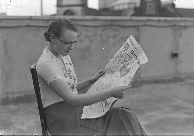 Woman reading the Daily Herald newspaper
    A photograph of a