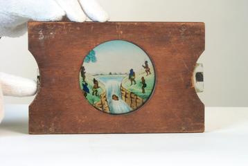 Magic lantern slide: Men alongside a river