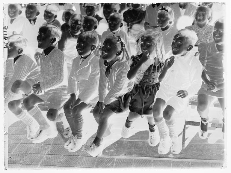 Entertaining war orphans
    A photograph of war orphans at a