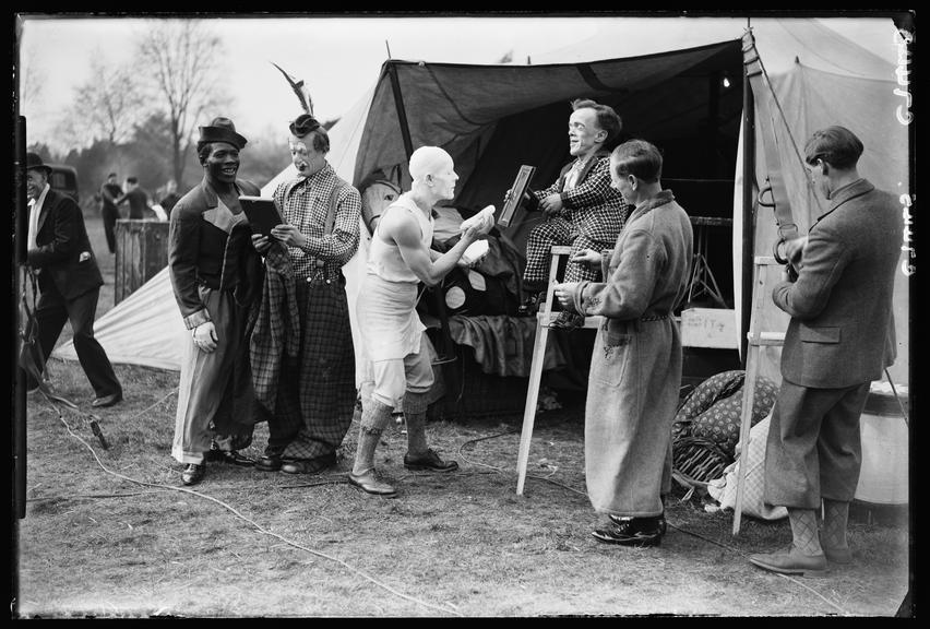 A group of clowns
    A photograph of a group of circus clowns