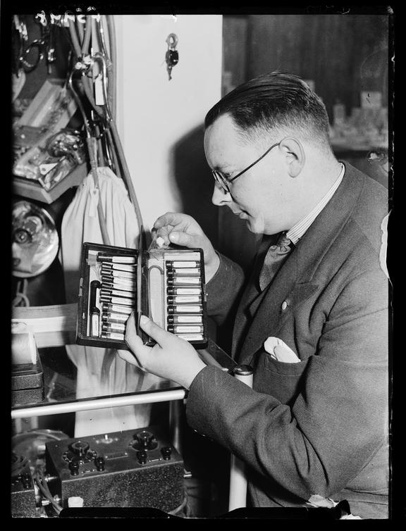 Man with a pocket laboratory
    A photograph of a man holding a