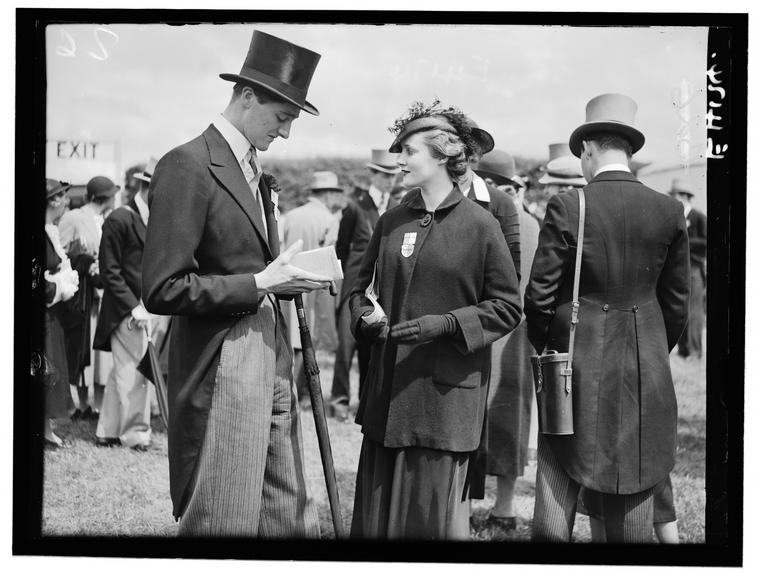 Racegoers at the Derby
    A photograph of a couple at the Derby