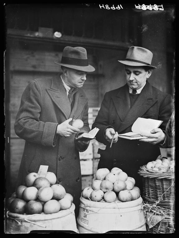 Market salesmen
    A photograph of two market salesmen