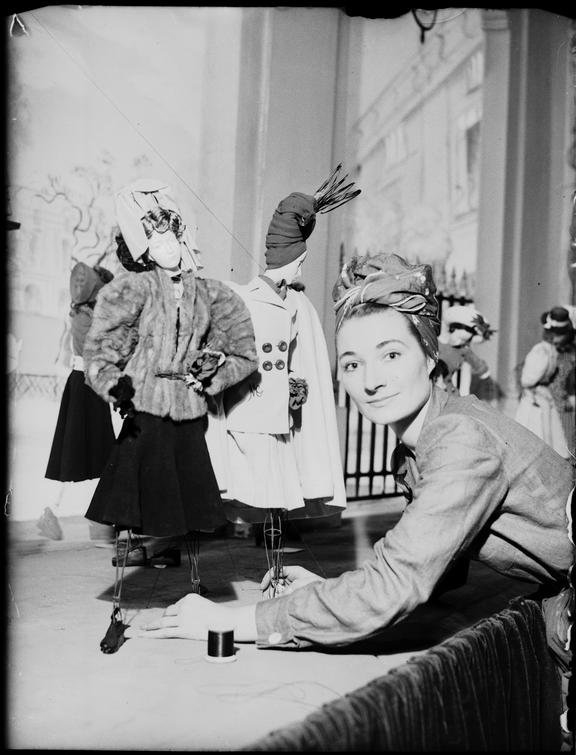 Designer with a clothing doll
    A photograph of a French