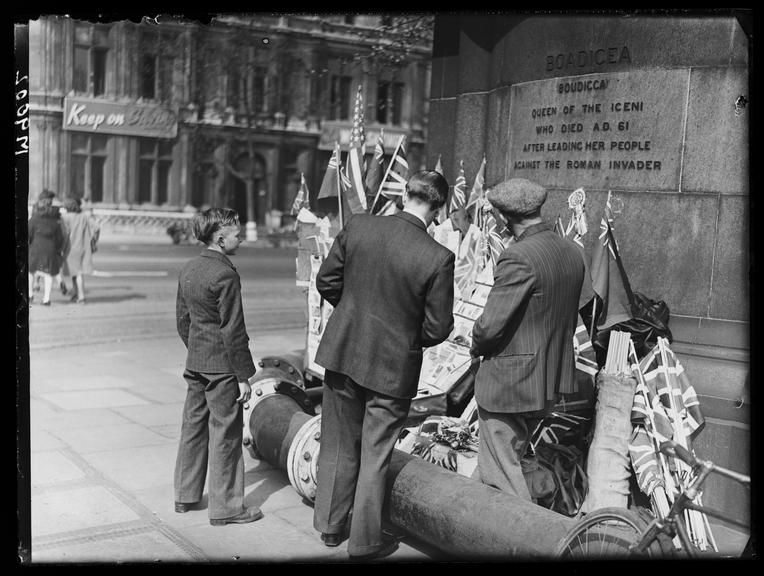 Flag seller
    A photograph of a man selling flags beneath the