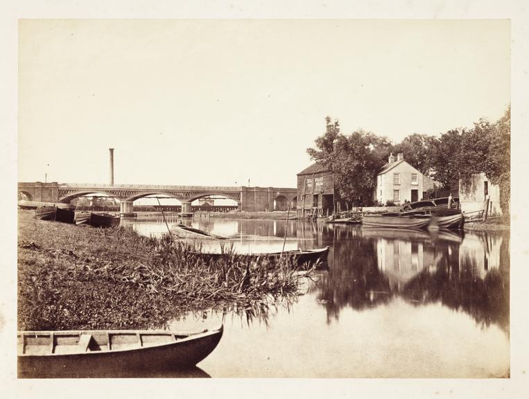 Boats on a river
    A photograph of rowing boats moored to the