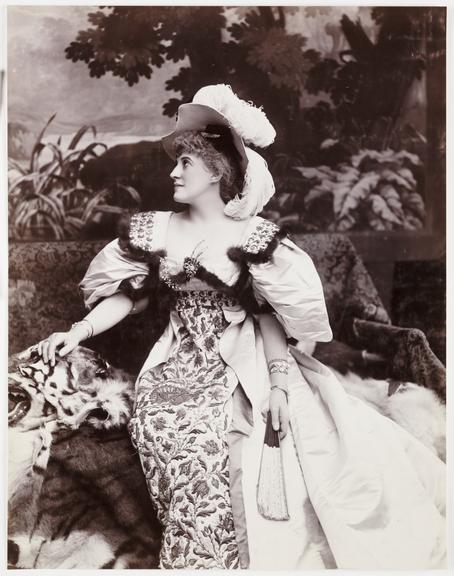 Woman wearing a plumed hat