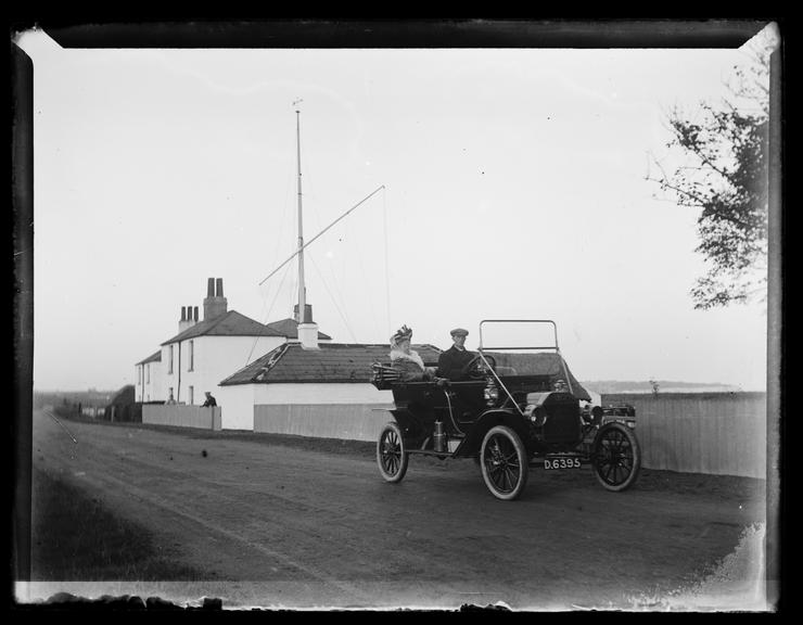 'Man And Woman In Ford Motor Car (Model 'T' Or 'N')