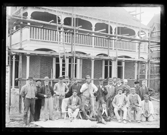 The Builders Harcourt Runnacles & Co. in front of The Bungalow