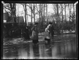 Women Skating on Pond