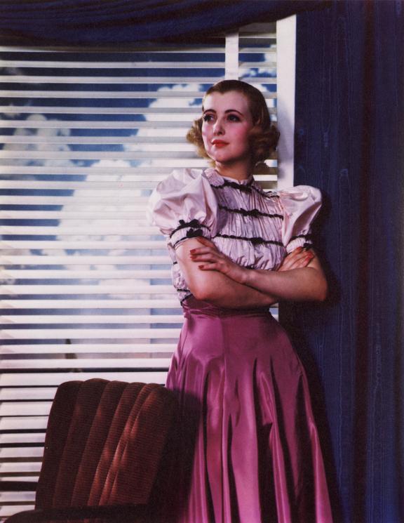 Woman standing by a window
    A Dye Transfer colour photograph of