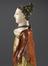 Coloured wax model of female, half skeletal