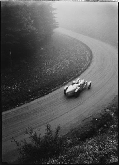 Bugatti racing car being driven along race track, Germany