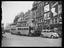 A London street scene with buses and cars
    Two Saidman brothers