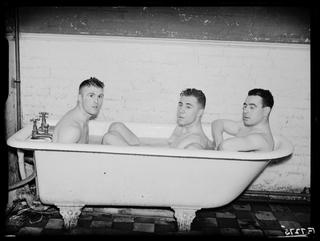 Everton footballers in the bath after training