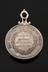 Medal, silver, with elaborate loop at top, awarded to Dr