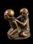 Wooden netsuke, in the form of two seated skeletons