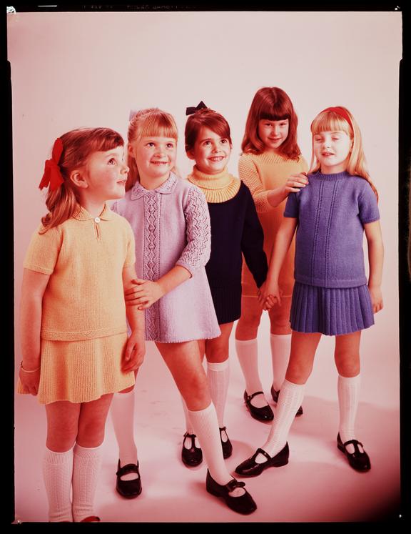 Five girls wearing knitwear