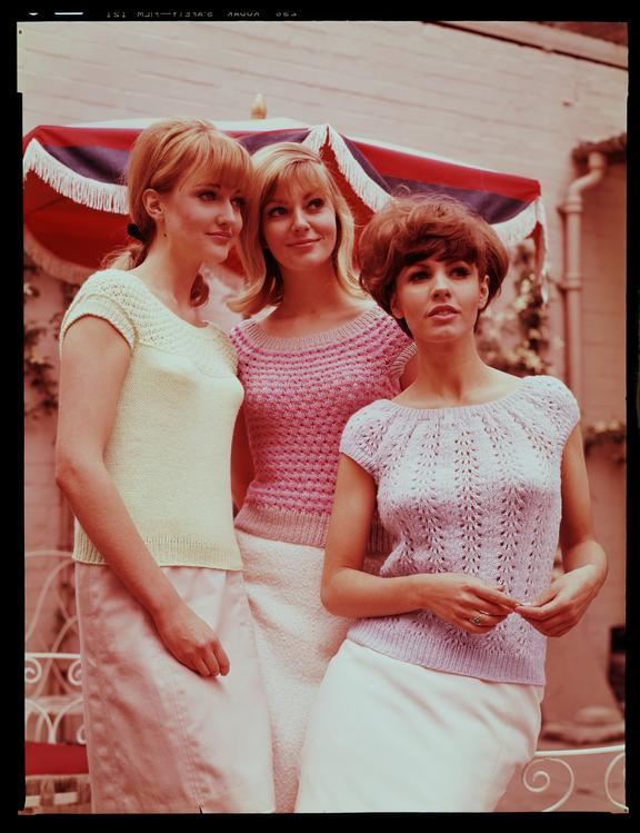 Three women wearing knitwear